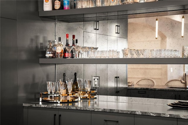 bar featuring a sink and a bar