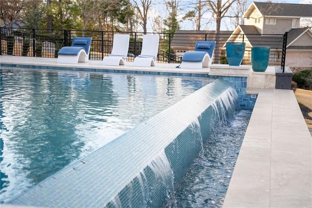 view of pool with fence and a fenced in pool