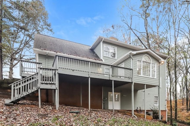 back of property with a wooden deck