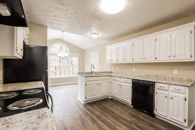 kitchen with sink, dark wood-type flooring, black appliances, white cabinets, and vaulted ceiling