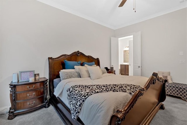 carpeted bedroom with crown molding, ceiling fan, and ensuite bath