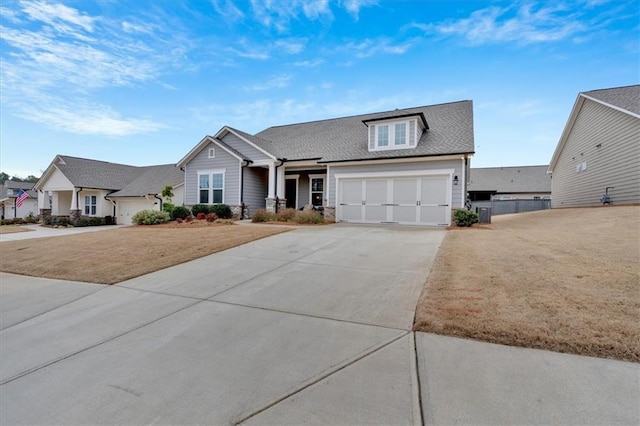 view of front of house with a garage and a front yard