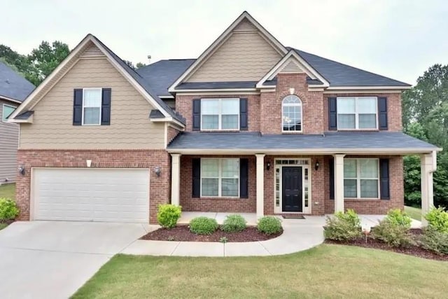 craftsman-style house with a garage and a front lawn