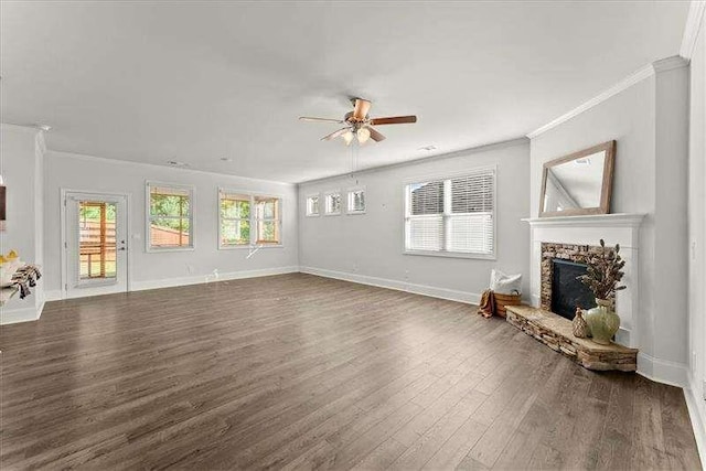 unfurnished living room with a fireplace, baseboards, and dark wood-type flooring