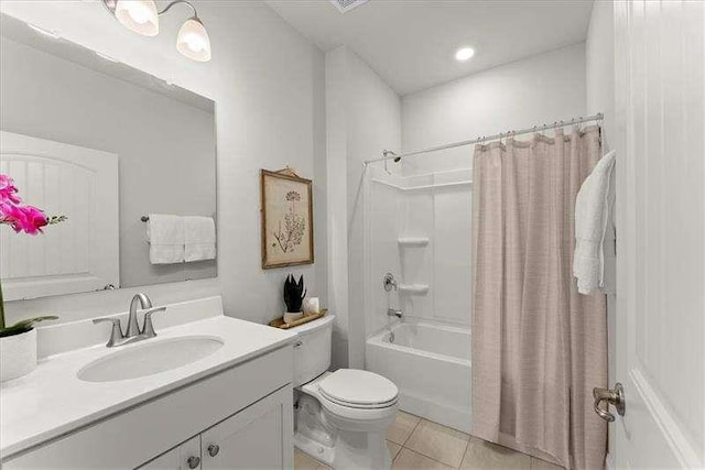 bathroom featuring tile patterned flooring, shower / bathtub combination with curtain, vanity, and toilet