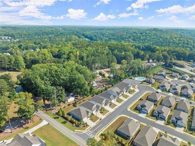 birds eye view of property featuring a residential view and a view of trees