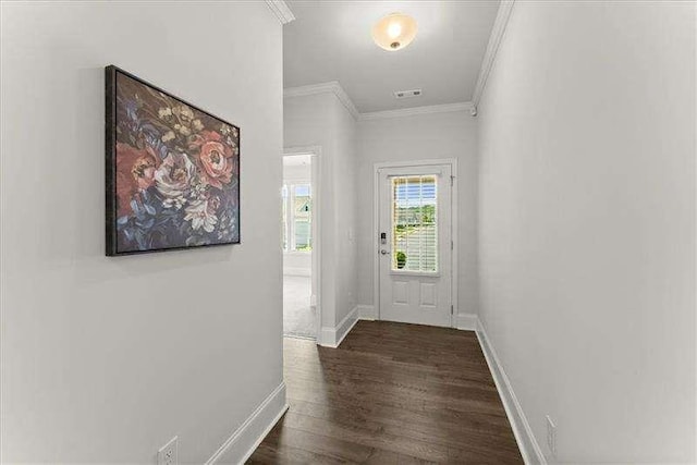 entryway featuring ornamental molding, visible vents, baseboards, and dark wood-style floors