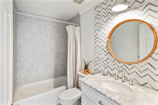 full bathroom featuring wallpapered walls, visible vents, toilet, shower / tub combo with curtain, and vanity