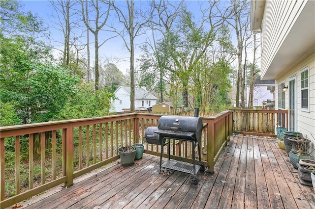 wooden deck featuring area for grilling