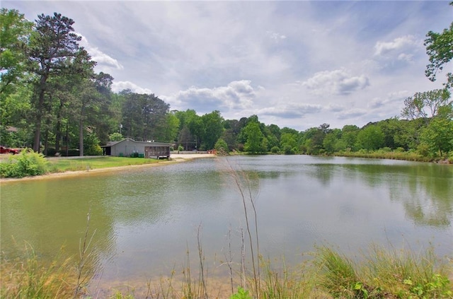 property view of water featuring a forest view