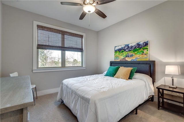 bedroom featuring light carpet and ceiling fan