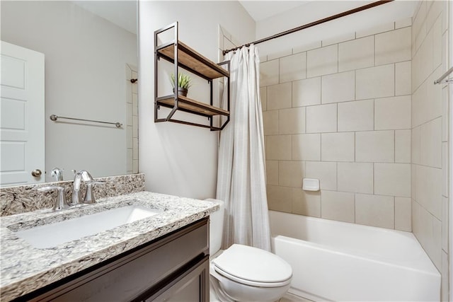 full bathroom featuring shower / tub combo with curtain, vanity, and toilet