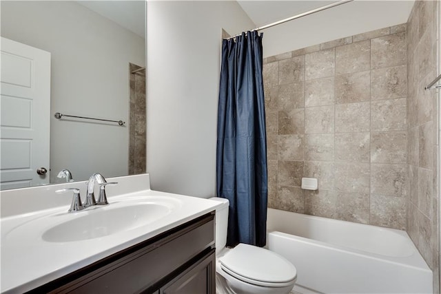 full bathroom with vanity, shower / tub combo with curtain, and toilet