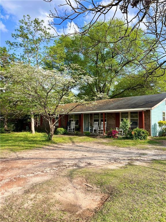 view of front of home with a front lawn and a porch