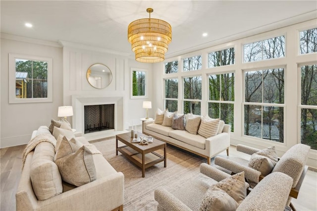 sunroom / solarium with an inviting chandelier