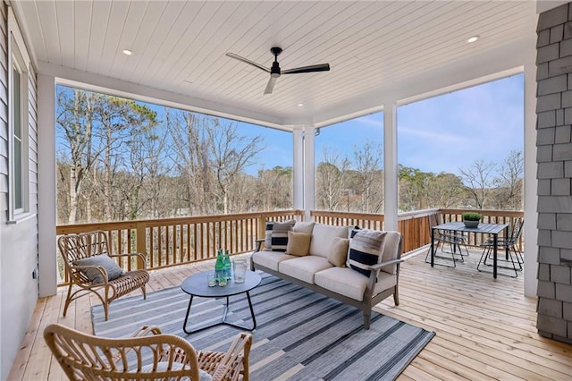 deck with an outdoor hangout area and ceiling fan