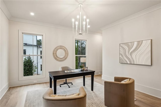 home office with ornamental molding, plenty of natural light, and a notable chandelier