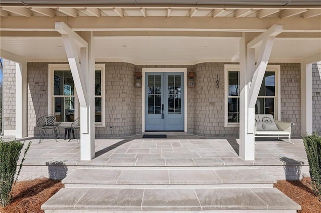 entrance to property with french doors and a patio