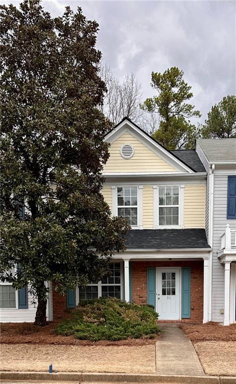 view of front of house featuring brick siding