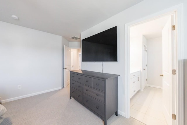 bedroom with light colored carpet, visible vents, and baseboards