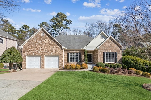 view of front property with a garage and a front lawn