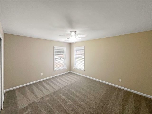 carpeted empty room featuring ceiling fan