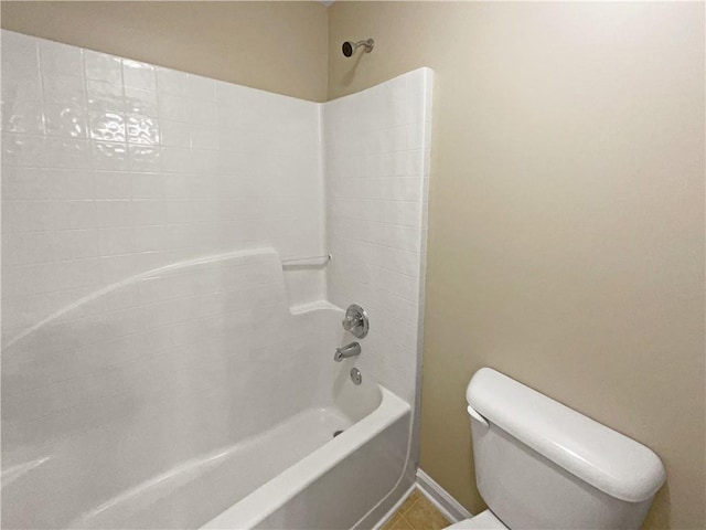 bathroom with toilet, tile patterned floors, and shower / tub combination