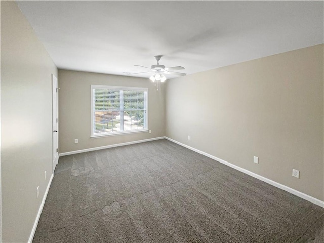 unfurnished room featuring ceiling fan and dark colored carpet