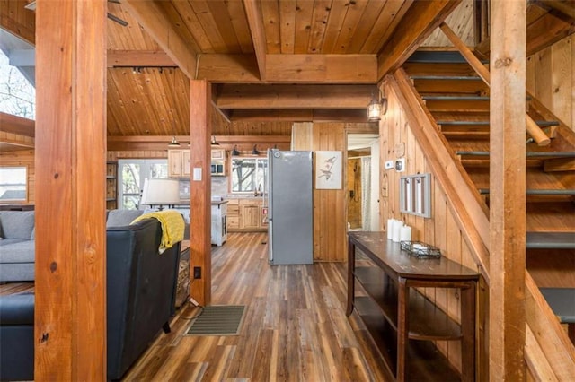 60 Laurel Ridge Ct, Ellijay, GA 30540 - kitchen with freestanding refrigerator, wooden ceiling with exposed beams, wood walls, and wood finished floors