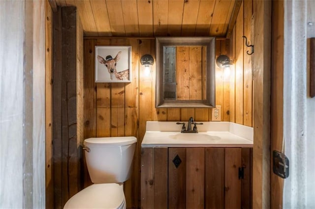 60 Laurel Ridge Ct, Ellijay, GA 30540 - bathroom with toilet, vanity, wooden ceiling, and wood walls