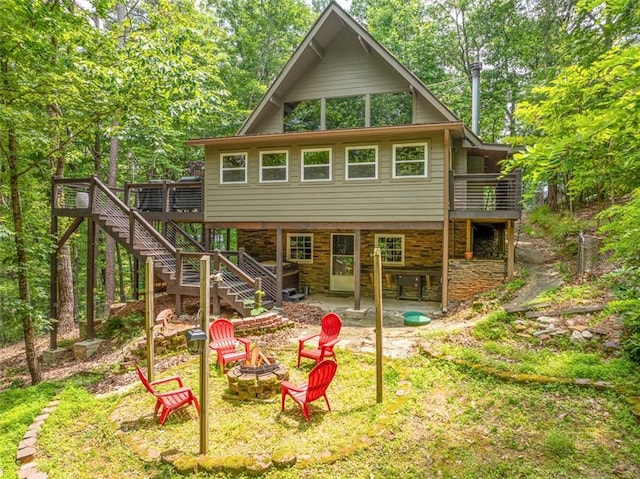 60 Laurel Ridge Ct, Ellijay, GA 30540 - rear view of house featuring a fire pit, stairway, a deck, a patio area, and stone siding