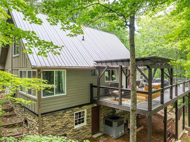 60 Laurel Ridge Ct, Ellijay, GA 30540 - back of property featuring a pergola, a wooden deck, metal roof, and stone siding