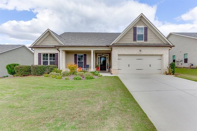 craftsman-style house with a front lawn and covered porch