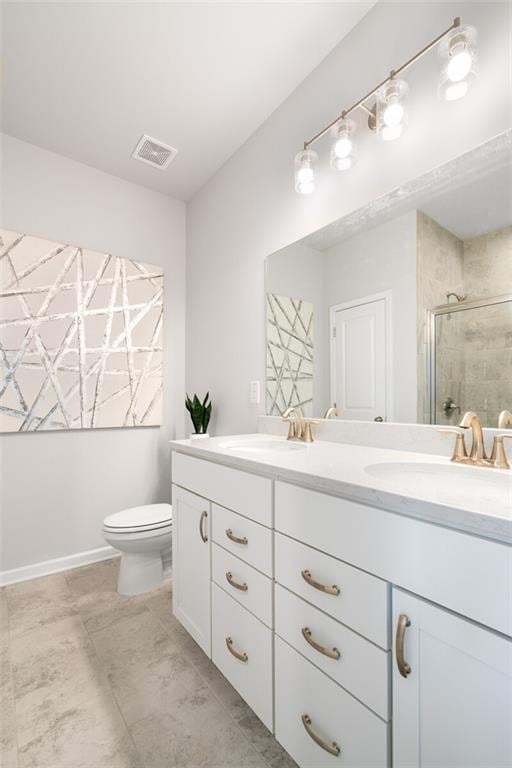 476 Village Ln, Fairburn, GA 30213 - full bath featuring double vanity, a stall shower, toilet, and baseboards