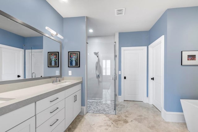full bath featuring a stall shower, double vanity, baseboards, a freestanding bath, and recessed lighting