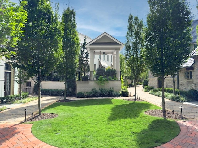 view of community featuring a yard