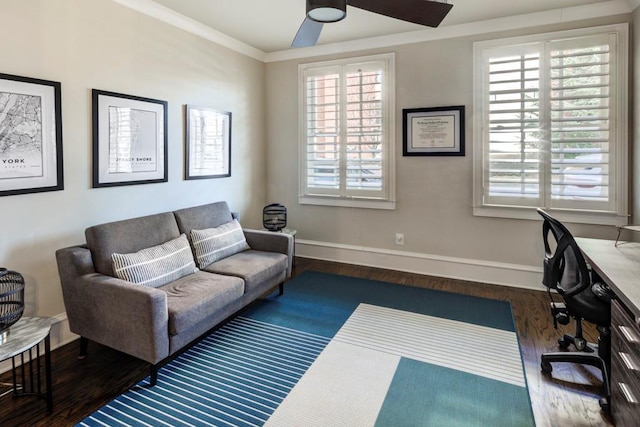 office featuring baseboards, wood finished floors, ceiling fan, and ornamental molding