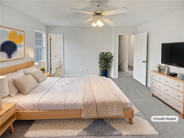 carpeted bedroom with ceiling fan