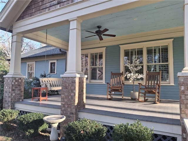 wooden deck with ceiling fan and covered porch