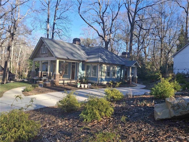 back of house featuring a porch