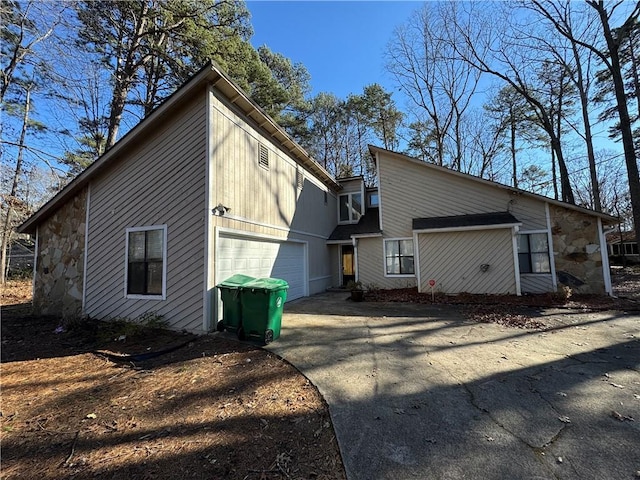 back of property featuring a garage