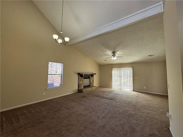 unfurnished living room featuring carpet, a textured ceiling, vaulted ceiling with beams, and a fireplace