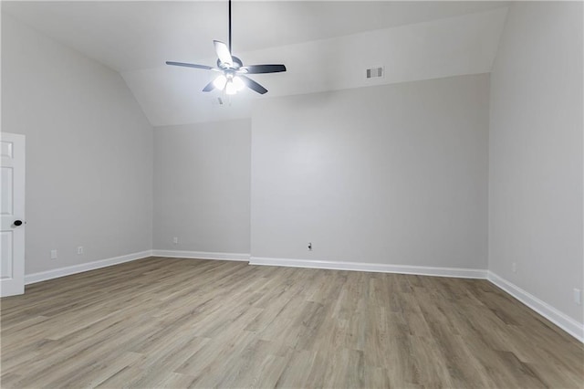 5096 Limerick Ln, Flowery Branch, GA 30542 - empty room featuring a ceiling fan, lofted ceiling, wood finished floors, and baseboards