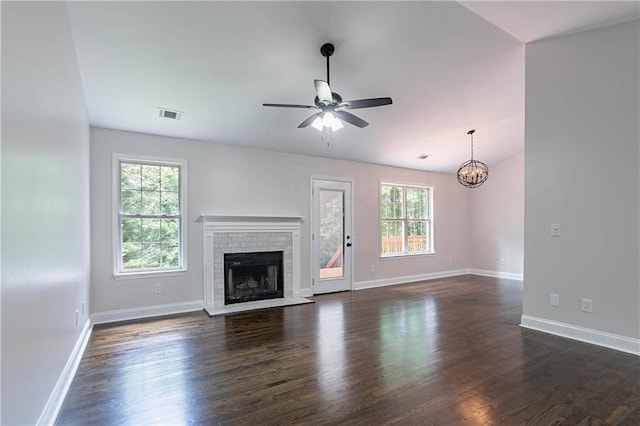 5096 Limerick Ln, Flowery Branch, GA 30542 - unfurnished living room featuring ceiling fan, dark wood-style floors, a brick fireplace, and baseboards
