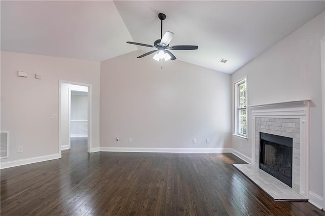 5096 Limerick Ln, Flowery Branch, GA 30542 - unfurnished living room with lofted ceiling, a ceiling fan, dark wood finished floors, baseboards, and a brick fireplace