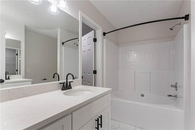 5096 Limerick Ln, Flowery Branch, GA 30542 - bathroom with marble finish floors, shower / bath combination, vanity, and a textured ceiling