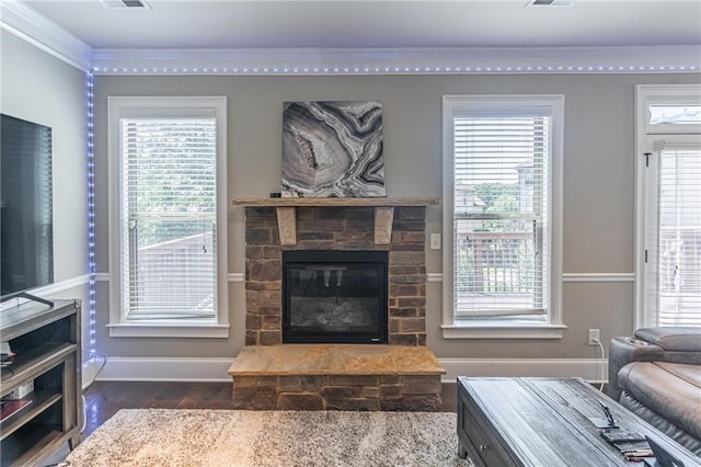 2183 Trinity Grove Ct, Dacula, GA 30019 - living room featuring crown molding, dark wood-style flooring, a fireplace, and plenty of natural light