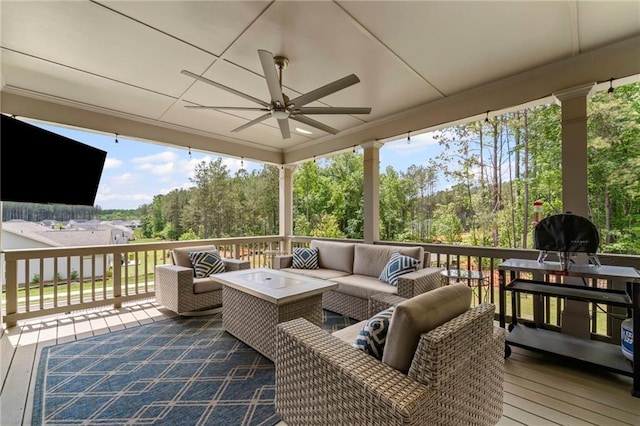 deck featuring a ceiling fan and an outdoor hangout area