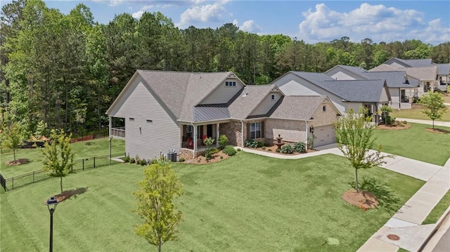 view of front of property featuring central AC unit, concrete driveway, and an attached garage