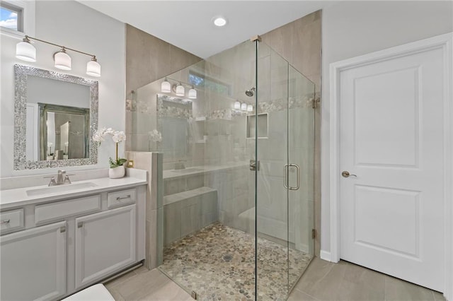 bathroom featuring a shower stall, vanity, recessed lighting, and tile patterned flooring